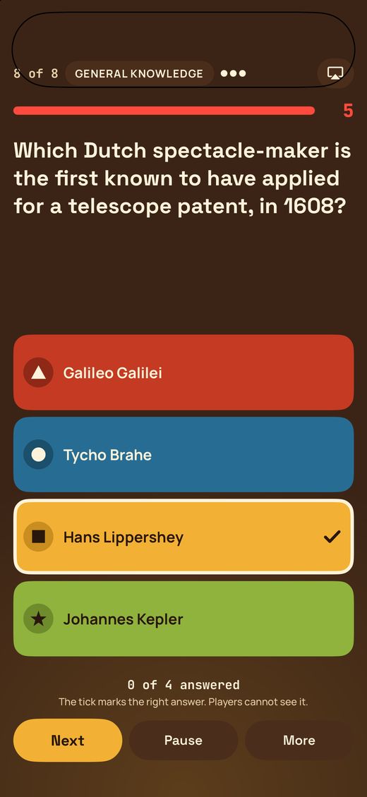 The host's iPhone showing a question with the correct answer ticked, which players cannot see